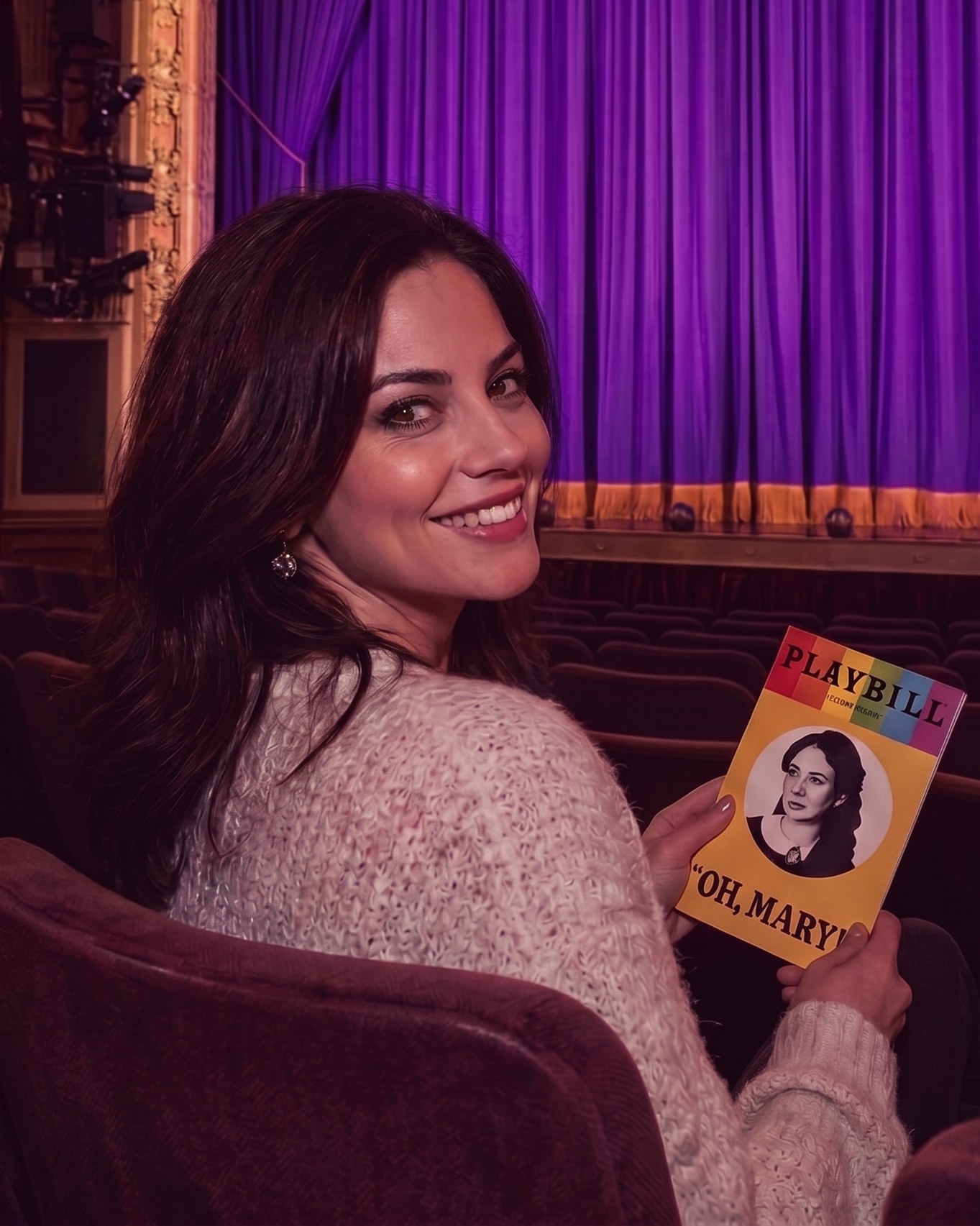 A woman enjoying a show on her own